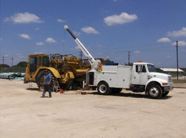 Service truck on-site with scraper
